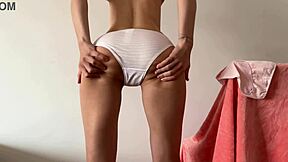 Showing off her new panties and getting her asshole wet