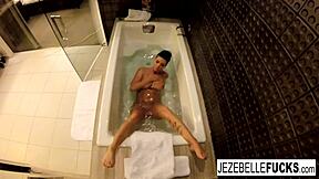 Brunette babe with big tits gets naughty in the bathtub