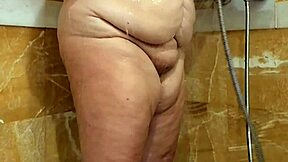 Voluptuous mature woman with big breasts showers