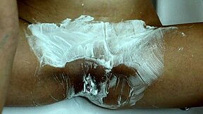 Closeup trimmer razor shave smooths juicy pussy bare