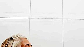 Milf shoves dildo deep in pussy in bathroom backstage