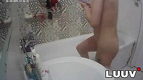 Luuv Elika spreads legs wide, shaves smooth in bathroom for voyeur cam.