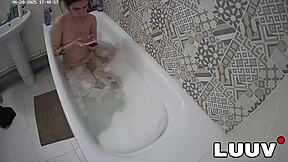 Luuv Elika spreads legs wide, shaves smooth in bathroom for voyeur cam.