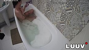 Luuv Elika spreads legs wide, shaves smooth in bathroom for voyeur cam.