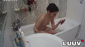 Luuv Elika spreads legs wide, shaves smooth in bathroom for voyeur cam.