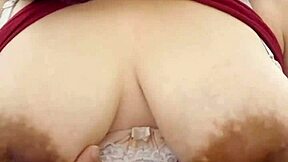 Her Massive Natural Tits Tease Fans in Steamy Striptease