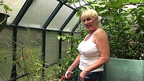 Rae Hart's huge wet tits glisten as she waters garden in milf tease