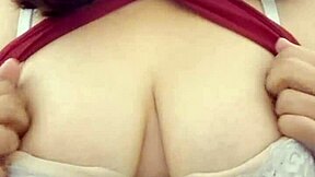 Her Massive Natural Tits Tease Fans in Steamy Striptease