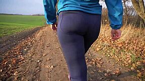 Milf's Tight Ass Teases in Yoga Leggings from Behind