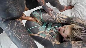Tattooed babe's shaved pussy and ass gaped by monster cock in bedroom