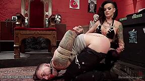 Punk rock goddess straps on and dominates inked man's ass with rough pegging action