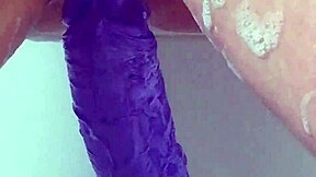 milf soaks in bath thrusting big purple 12-inch dildo till she cums hard