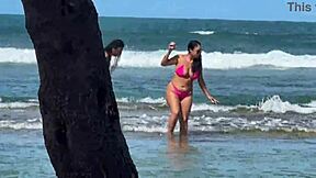 two pretty latinas kiss big asses on public beach