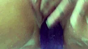 milf soaks in bath thrusting big purple 12-inch dildo till she cums hard