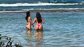 two pretty latinas kiss big asses on public beach