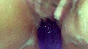 milf soaks in bath thrusting big purple 12-inch dildo till she cums hard