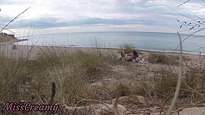 French teacher slut flashes small tits on nude beach, sucks stranger's monster cock publicly with cumshot