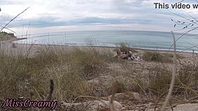 French teacher slut flashes small tits on nude beach, sucks stranger's monster cock publicly with cumshot