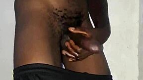 Kenyan stud's massive black cock gets stroked hard on homemade camera