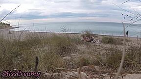 French teacher slut flashes small tits on nude beach, sucks stranger's monster cock publicly with cumshot