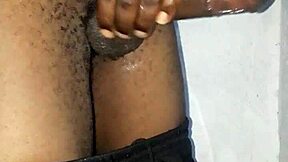 Kenyan stud's massive black cock gets stroked hard on homemade camera