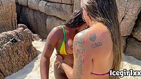 Sexy Brazilian blonde's big tits and ass almost caught in hidden beach orgy massage.