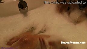 Horny Indian Auntie's Big Tits Soak in Steamy Shower Show!