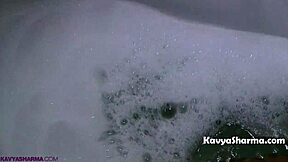 Horny Indian Auntie's Big Tits Soak in Steamy Shower Show!