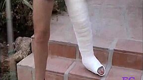 i hobble on my cast leg outdoors in leggings for kinky spanking pain