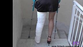 i hobble on my cast leg outdoors in leggings for kinky spanking pain