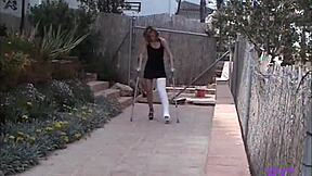 i hobble on my cast leg outdoors in leggings for kinky spanking pain