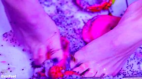 bare toes slowly crush and squish juicy fruit in barefoot fetish play