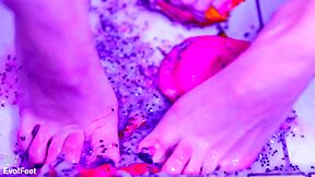 bare toes slowly crush and squish juicy fruit in barefoot fetish play