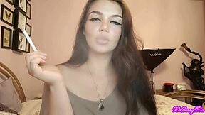 Xo Bunny blows thick smoke intensely from blue-eyed brunette Latina face right at you