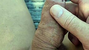 jerking naked cock slowly in shade on sunny lounger