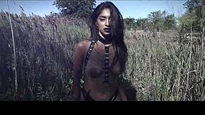 the sexy model poses topless under the sun during her outdoor photoshoot