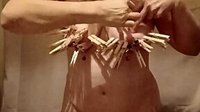 french milf slave pinned with nipple clamps and belt whipped in outdoor bdsm humiliation
