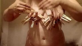 french milf slave pinned with nipple clamps and belt whipped in outdoor bdsm humiliation