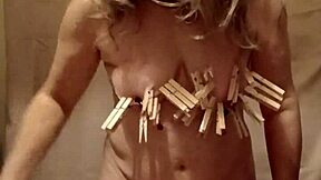 french milf slave pinned with nipple clamps and belt whipped in outdoor bdsm humiliation