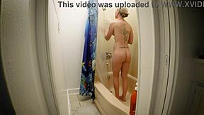 kristi love's big tits bounce while she fingers wet pussy in steamy shower