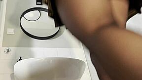 Big tits big ass hot blonde babe in pantyhose and high heels with a miniskirt does a striptease in the bathroom