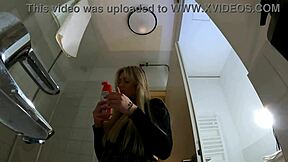 Big tits big ass hot blonde babe in pantyhose and high heels with a miniskirt does a striptease in the bathroom