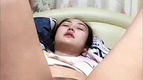 amateur japanese girl fingers her horny pussy until she squirts hard