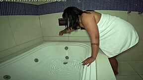 Naughty girl in motel bathtub plays with herself and smokes