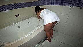 Naughty girl in motel bathtub plays with herself and smokes