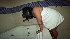 Naughty girl in motel bathtub plays with herself and smokes