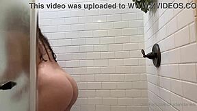 Dani Daniels showers and squirts with her tits