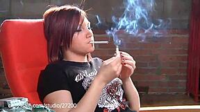 Smoking woman exhales sexy from her nose