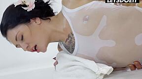 Tattooed babe in oiled bodysuit rides cowgirl then gets fucked doggy she cant stop moaning