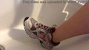Nicoletta cleans sneakers in bathroom